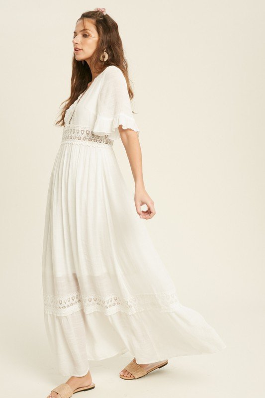 Model wearing PERFECT WHITE MAXI dress with crochet lace trim from Raggdoll Boutique, showcasing trendy coastal style.