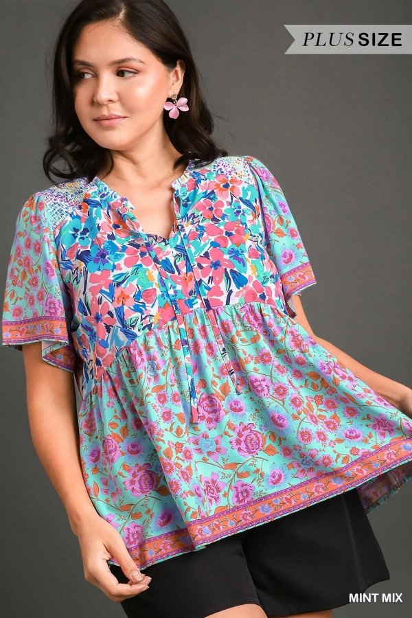 Plus size model wearing the MINT FLORAL MIX top from Raggdoll Boutique, perfect for summer outfits Texas.