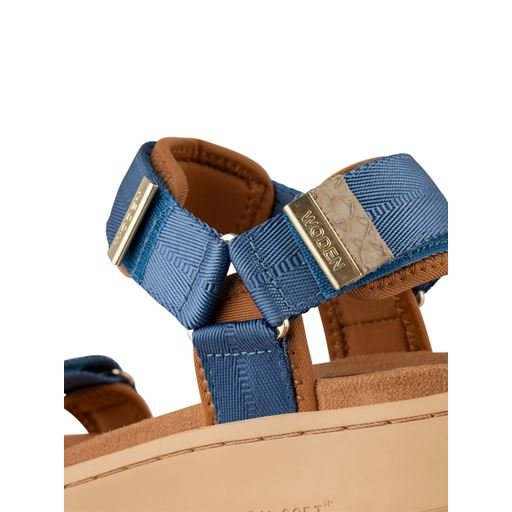 Close-up of Woden Denim Sandals with adjustable straps, perfect for summer outfits at Port Aransas boutique and coastal vacations.