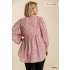Back view of PLUS ANIMAL PRINT V-NECK BABYDOLL TOP from Raggdoll Boutique, showcasing smocked detail and high low hem.