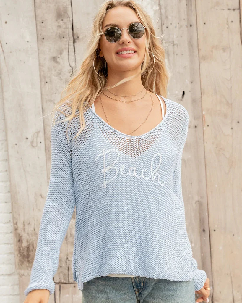 Lightweight blue sweater with 'Beach' embroidery, perfect for coastal boutique clothing and summer outfits.