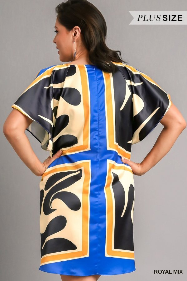 Back view of ROYAL MIX PLUS DRESS, a trendy piece from Raggdoll Boutique, perfect for coastal fashion and summer outfits.