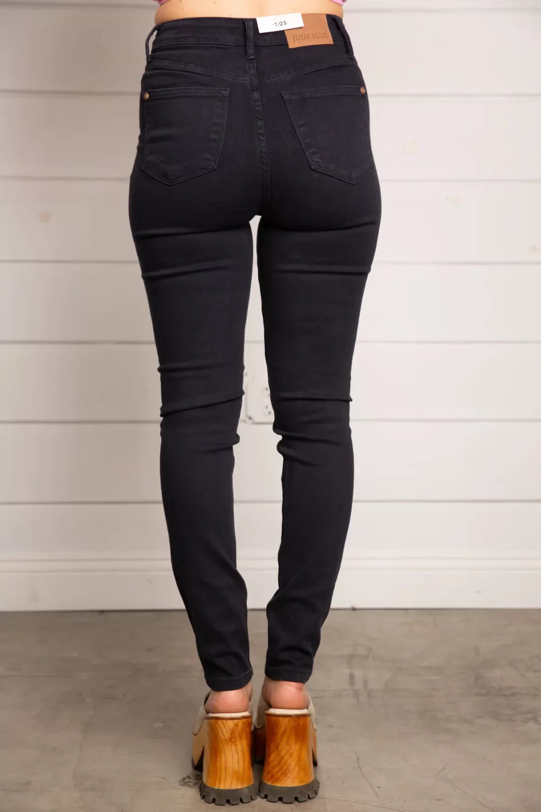 JUDY BLUE HW TUMMY CONTROL SKINNY-NAVY shown from behind, perfect for trendy coastal style at Raggdoll Boutique.