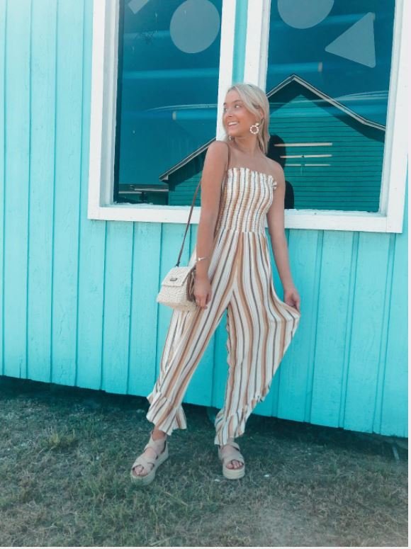 YELLOW STRIPED MULTI JUMPSUIT WITH SMOCKED TOP at Raggdoll Boutique, trendy coastal style for summer outfits Texas.